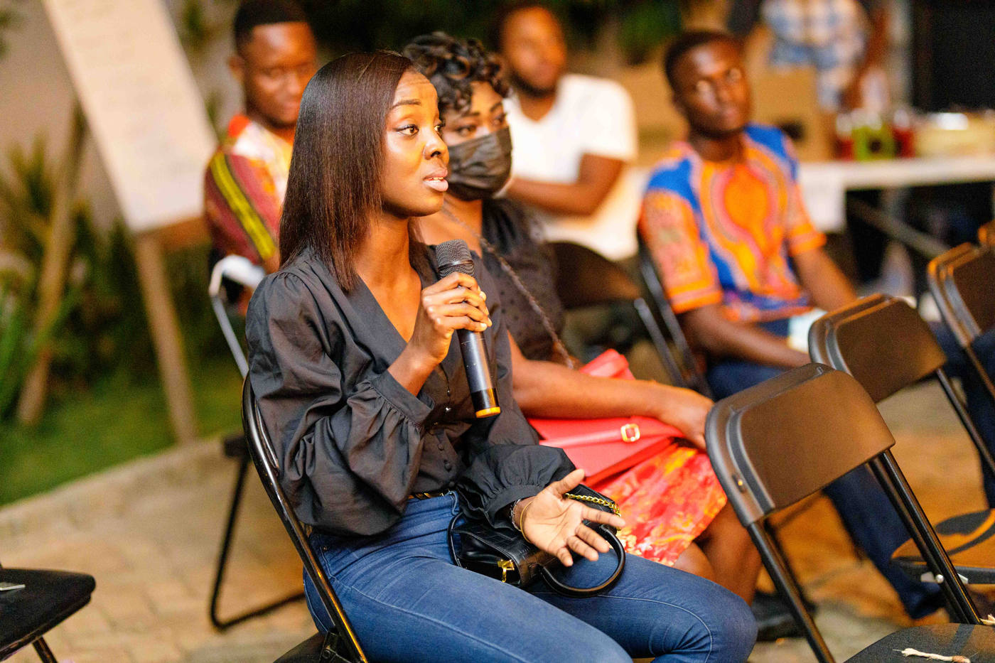A member holding the microphone